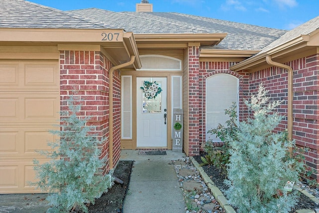 doorway to property featuring a garage