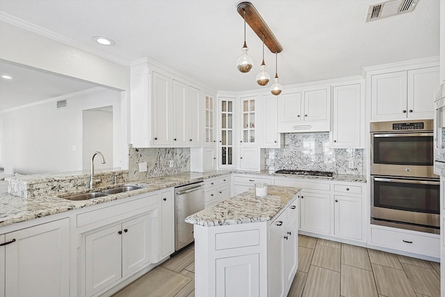 kitchen featuring white cabinetry, visible vents, appliances with stainless steel finishes, and a sink