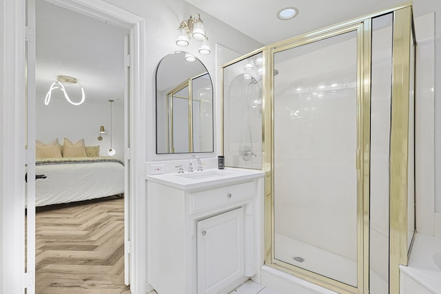 bathroom with a shower stall, ensuite bath, and vanity