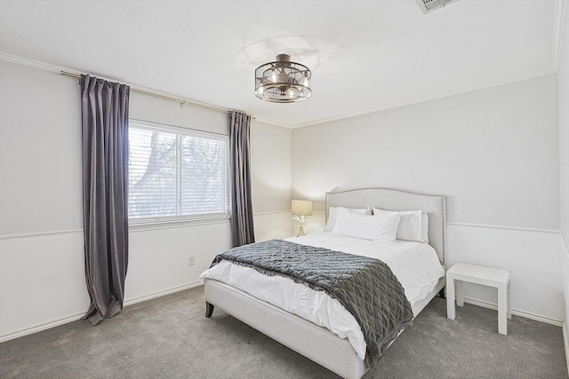 carpeted bedroom with baseboards and crown molding