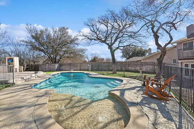 view of swimming pool featuring a fenced in pool, a patio, and a fenced backyard