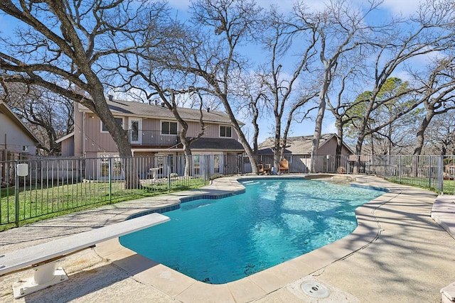 view of swimming pool with a patio area, a residential view, a fenced in pool, and a fenced backyard