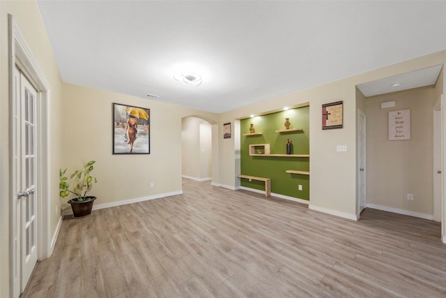 spare room featuring light hardwood / wood-style floors