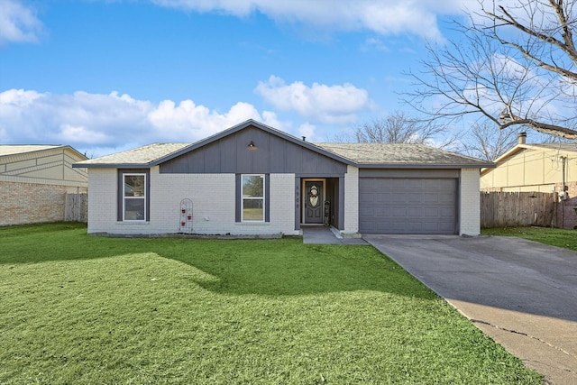 ranch-style home featuring a garage and a front yard