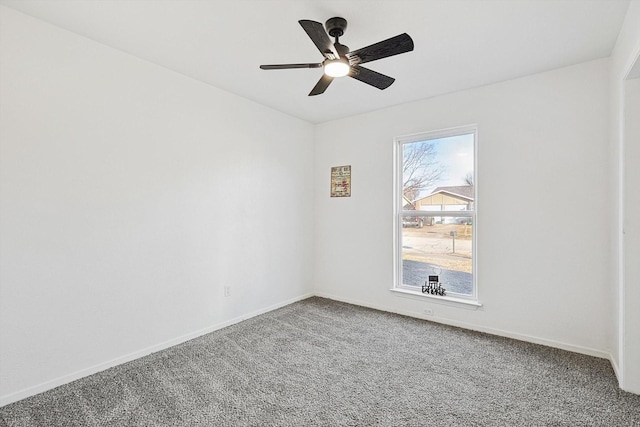 empty room with carpet flooring and ceiling fan