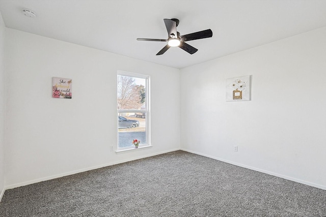 spare room featuring carpet flooring and ceiling fan