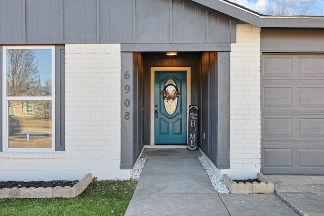 doorway to property featuring a garage