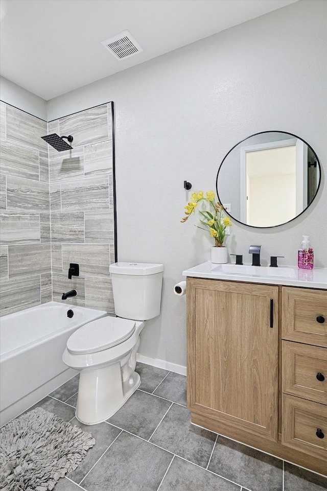 full bathroom with vanity, tile patterned flooring, tiled shower / bath combo, and toilet