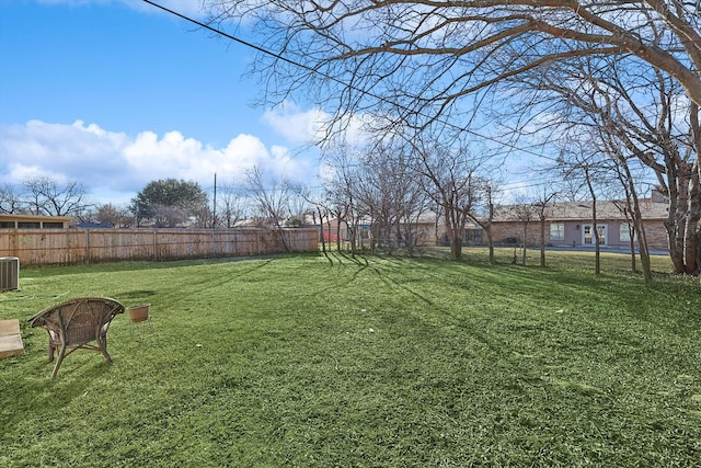 view of yard with central air condition unit