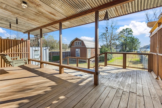 wooden terrace with a storage unit