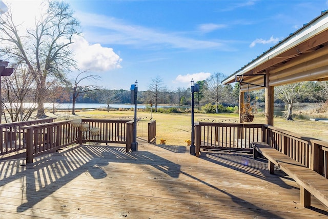 wooden terrace featuring a water view