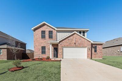 front facade with a front yard