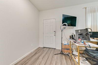 office area with light hardwood / wood-style flooring