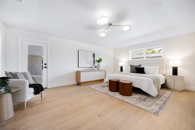 bedroom with light wood-type flooring