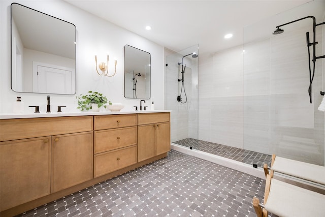 bathroom featuring vanity and tiled shower