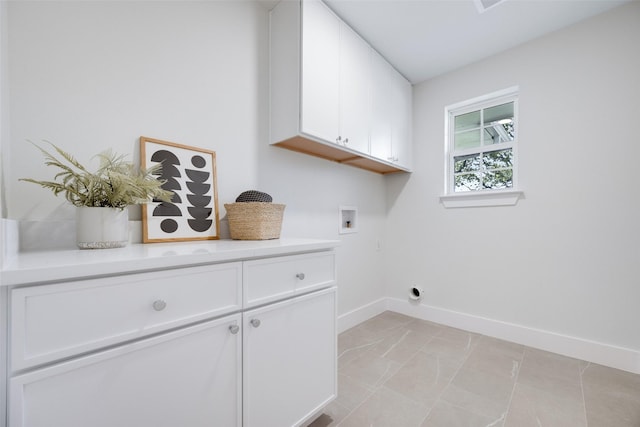 washroom featuring cabinets and washer hookup