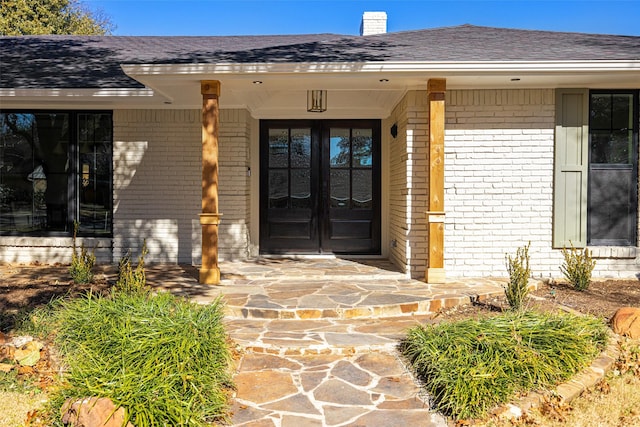 doorway to property featuring french doors and a porch