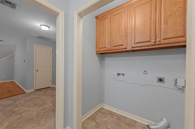 clothes washing area featuring cabinets, gas dryer hookup, washer hookup, and hookup for an electric dryer