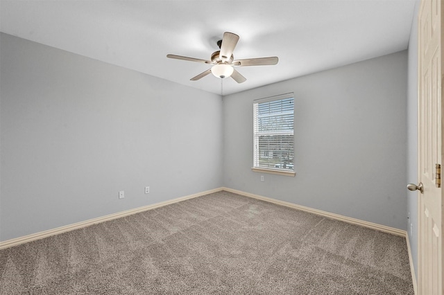 carpeted empty room featuring ceiling fan