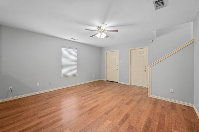 unfurnished room with ceiling fan and light hardwood / wood-style floors