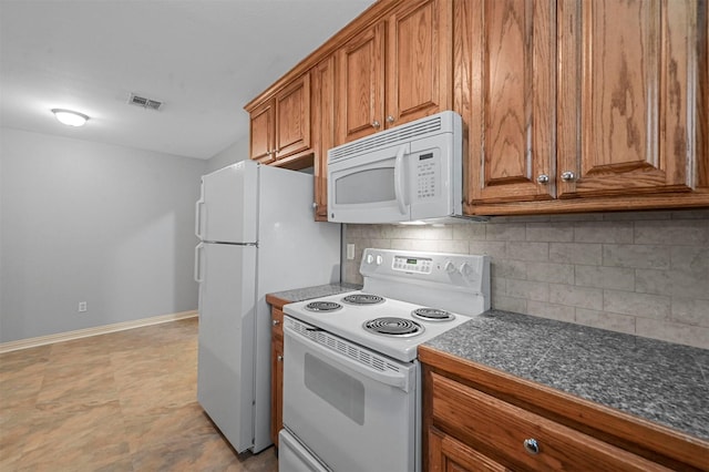 kitchen with white appliances and decorative backsplash