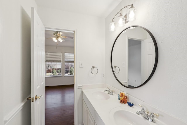 bathroom featuring vanity, hardwood / wood-style floors, and ceiling fan