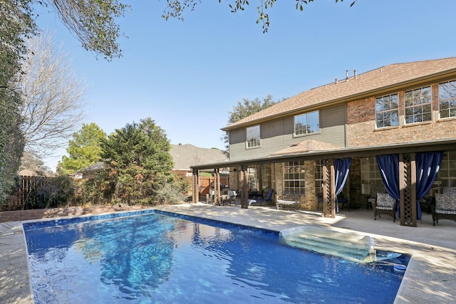 view of swimming pool with a patio