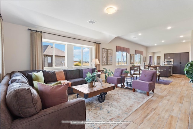 living room with light hardwood / wood-style flooring