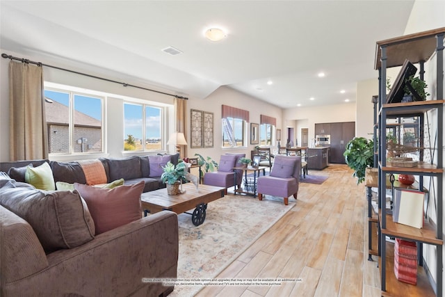 living room with light hardwood / wood-style flooring