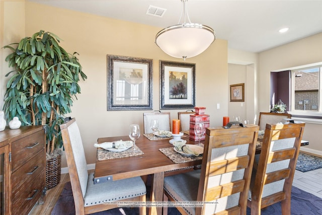 dining space with dark hardwood / wood-style floors