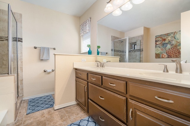 bathroom with vanity, tile patterned flooring, and a shower with door