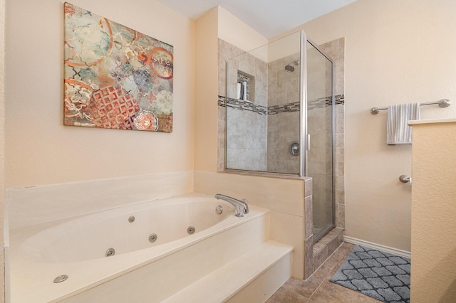 bathroom with tile patterned floors and shower with separate bathtub