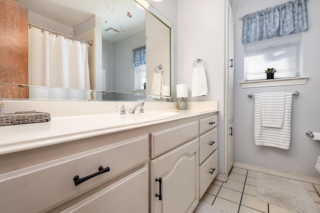 bathroom with vanity and tile patterned flooring