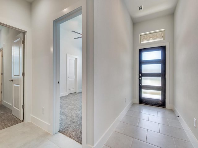 view of carpeted foyer