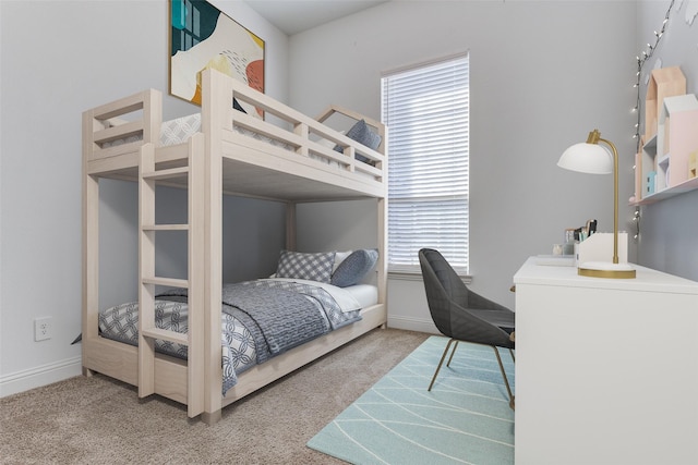 bedroom featuring multiple windows and carpet