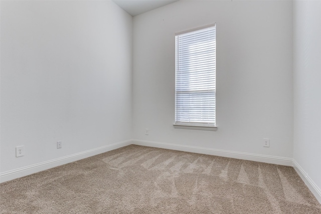 empty room with carpet flooring