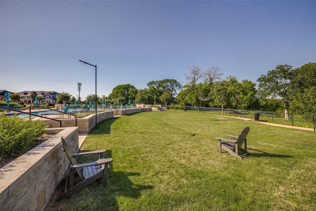 view of home's community featuring a lawn