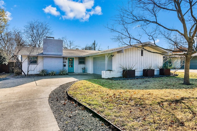 single story home featuring a garage and a front yard