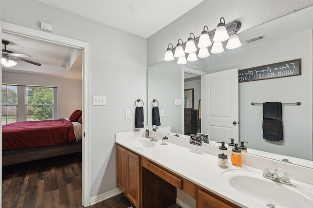 bathroom featuring vanity, hardwood / wood-style floors, and ceiling fan