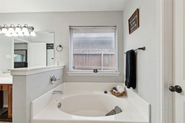 bathroom featuring vanity and a bathtub