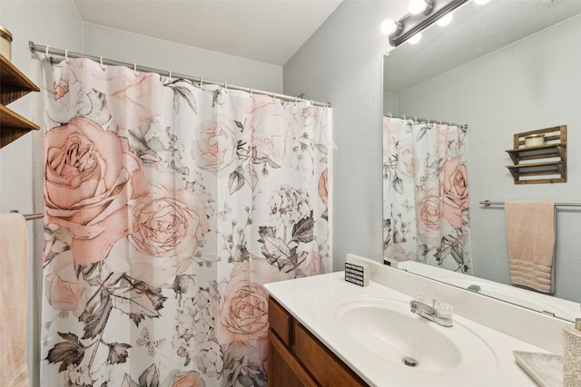 bathroom featuring vanity and a shower with curtain