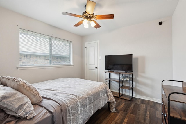 bedroom with dark hardwood / wood-style floors and ceiling fan