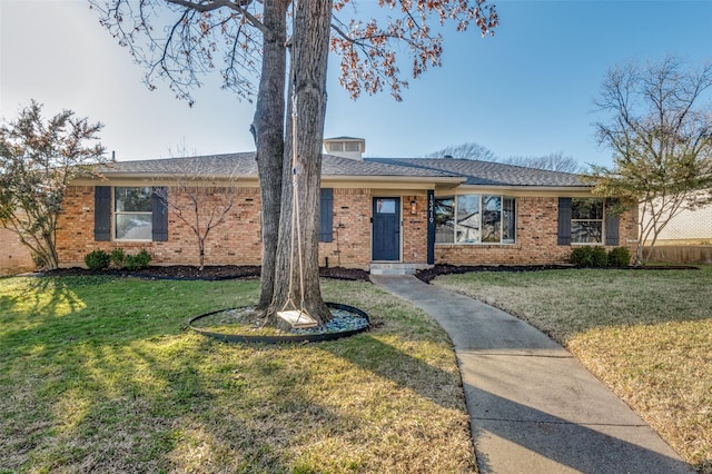 ranch-style house with a front lawn