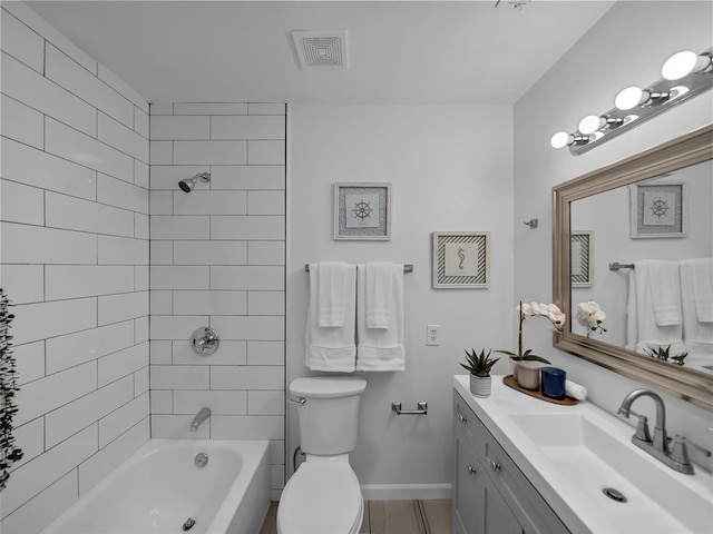 full bathroom featuring tiled shower / bath, vanity, toilet, and wood-type flooring