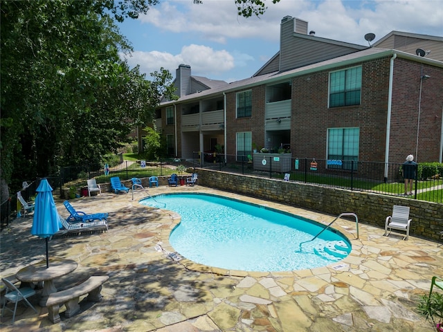 view of pool featuring a patio