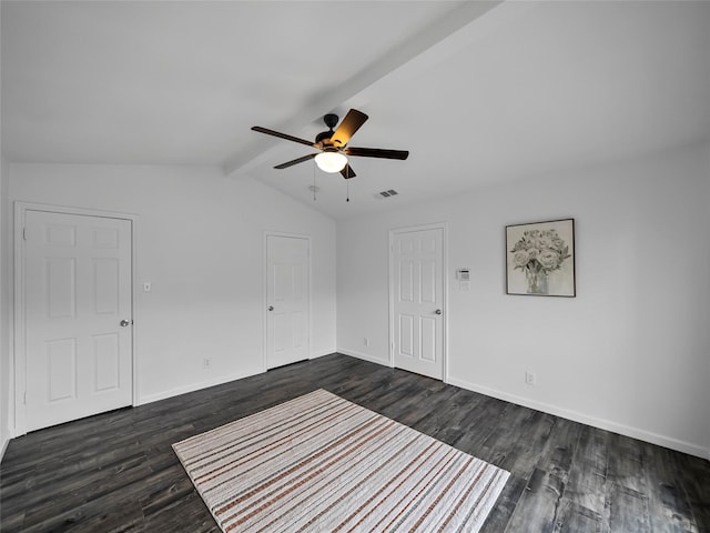 empty room featuring ceiling fan, dark hardwood / wood-style floors, and lofted ceiling with beams