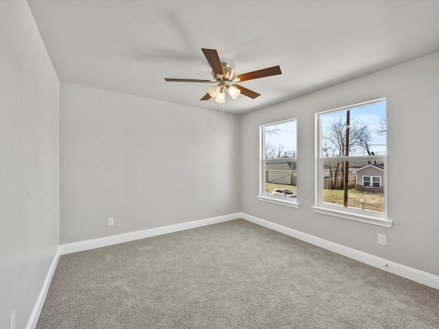 carpeted empty room with ceiling fan