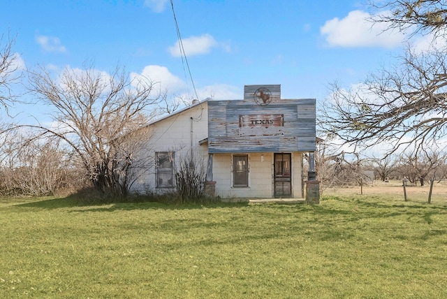 view of outbuilding featuring a lawn