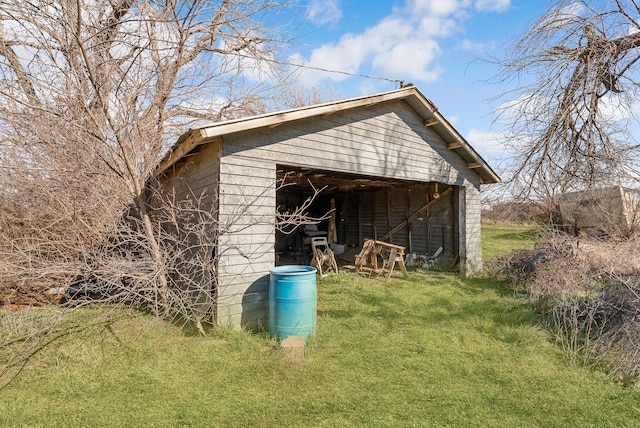 view of outdoor structure with a lawn