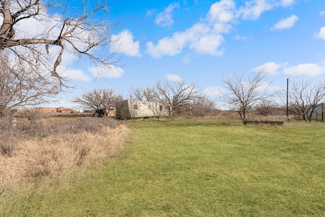 view of yard with a rural view